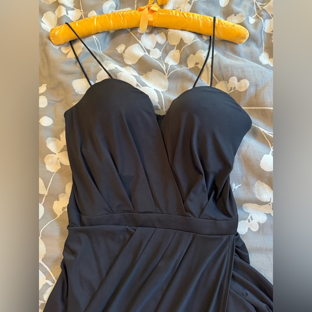 Black dress, worn once (to a wedding). Bustier style top with draping, lined.